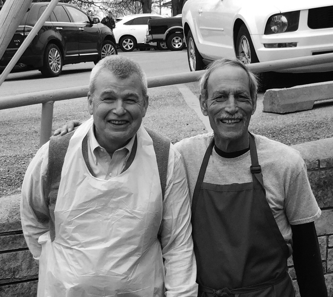 Bill Giles, on the left, with Bill Wilson, both wearing aprons and smiling for the camera