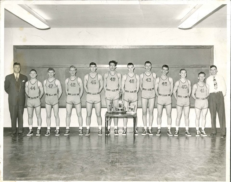 Holy Name championship basketball team with trophy