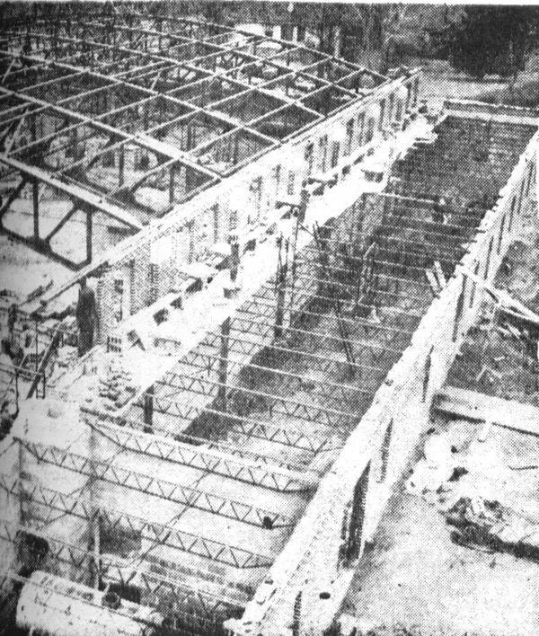 The Holy Name field house under construction in 1949, showing the steel roof trusses